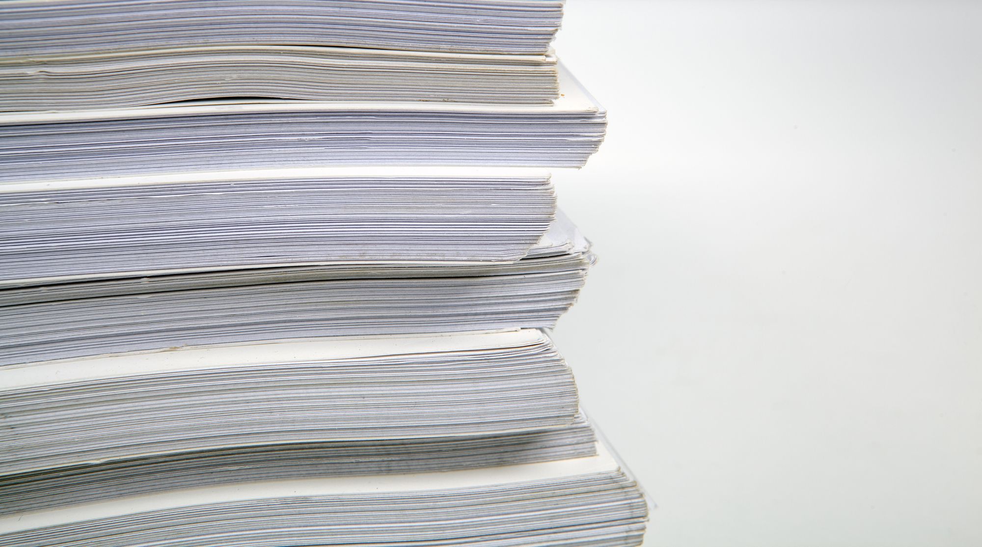 stack of white paper documentation close up